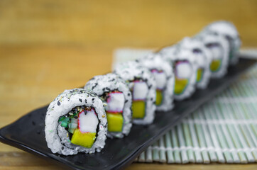 California roll on beautiful decorated plate