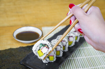 California roll on beautiful decorated plate