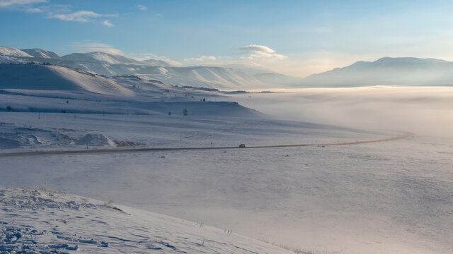 Winter look of Chuya Highway (Chuysky Trakt) in Kuray steppe. Altai Republic, Siberia, Russia..