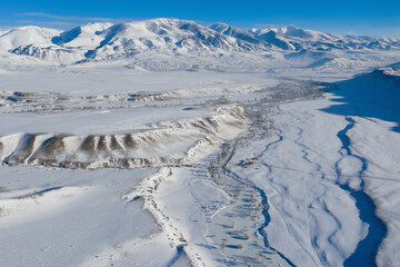 Winter Altai landscape. Aerial view of Kyzylchin river valley and Terektinsky Range. © Kirill