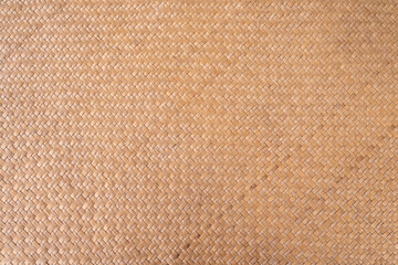 Fototapeta na wymiar Thai dry wicker pattern called Krajood in brown tone.