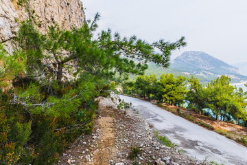 Fototapeta na wymiar mountain path against the backdrop of a seascape on the Mediterranean coast of Antalya near Beldibi, Turkey