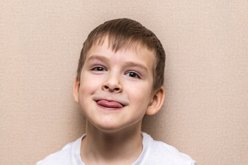 Fototapeta premium close-up portrait of a boy of six years old. Shows language