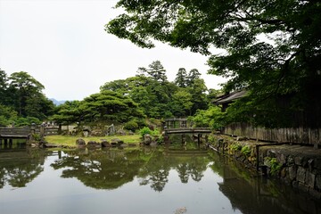 Fototapeta na wymiar Japanese garden and Moat at Hikone castle in Shiga Prefecture, Japan - 彦根城 お堀 城壁 日本 滋賀