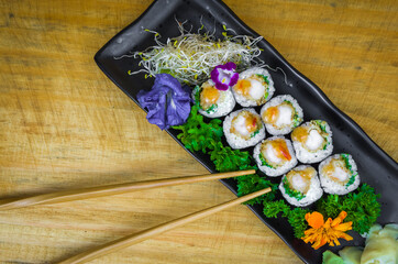 Delicious hossomaki on the decorated plate