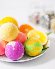 multicolored bath bombs on a light background