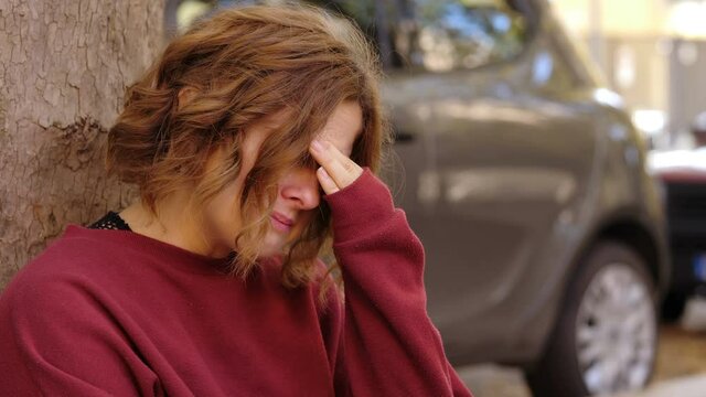 sadness, unhappiness - young woman cries thinking about her ex boyfriend