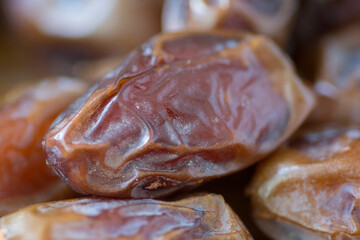 Close up view of dried Medjool dates (fruits of the date palm) piled up 
