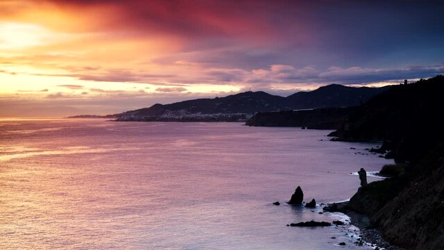 Coast landscape at sunset. Cliffs of Maro Cerro Gordo Natural Park, near Maro and Nerja, Malaga province, Costa Del Sol, Andalusia, Spain.