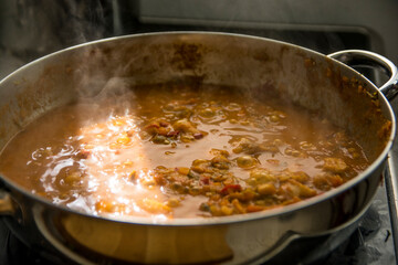Boiling pot of Chraime, a traditional sephardic north African soup, with fish and vegetables