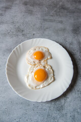 Egg poach sunny side up a healthy food ingredient on a plate.