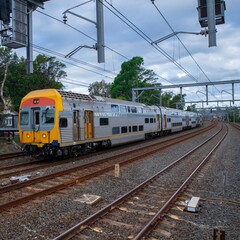 Commuter Train fast moving through a Station in Sydney NSW Australia