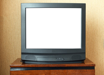Antique TV with white screen on antique wooden cabinet, vintage design in 80s and 90s style house.
