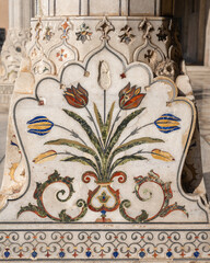 Stunning colorful pietra dura bouquet of tulips on the base of a white marble column in the Sheesh Mahal of Lahore fort, Punjab, Pakistan a UNESCO World Heritage site