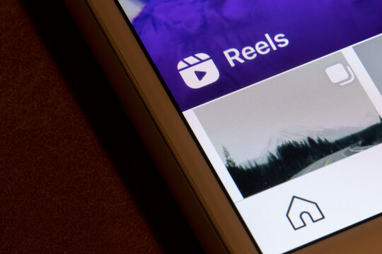 Portland, OR, USA - Feb 10, 2021: Reels icon is seen on the Instagram app interface from an iPhone. Reels is a new content format for Instagram that allows users to create and share short-form videos.