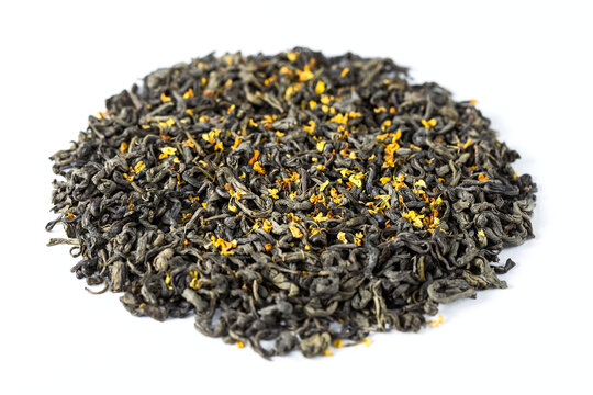 A heap of rolled green tea leaves with sweet dried osmanthus flower. Traditional oxidized Chinese tea. A view from above