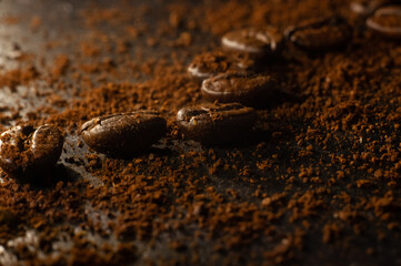 Fragrant coffee beans lie on a black background.