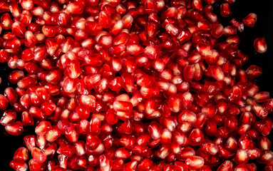 juicy red pomegranate seeds close up