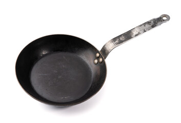 Vintage forged black frying pan on white background