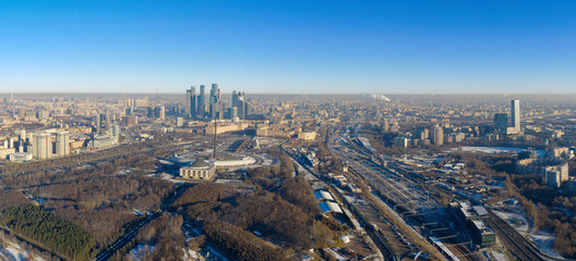Fototapeta na wymiar Panoramic aerial view of the city, Victory park and Moscow city at sunny winter day. Moscow, Russia.