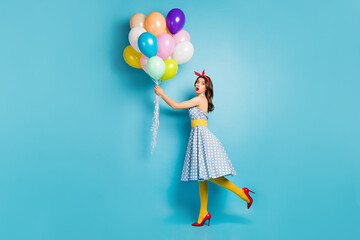 Full length body size view of her she nice attractive amazed wavy-haired girl holding air balls preparing corporate event evening date meet isolated on bright vivid shine vibrant blue color background