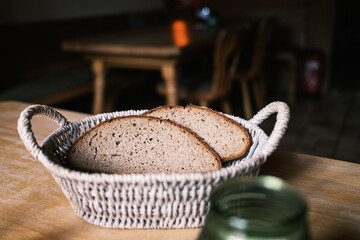 bread in basket on wooden table