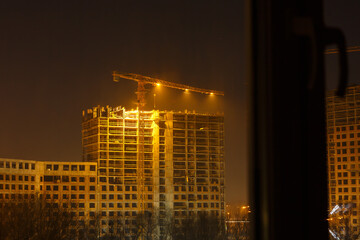 Construction with cranes at evening