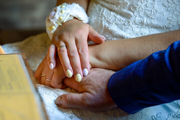 Beautiful flowers and wedding rings on the wedding day.
