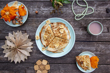 Fototapeta premium delicious Sunday breakfast - thin delicate pancakes with fruit