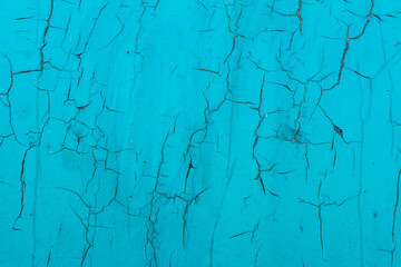 Abstract weathered green metal surface background covered with cracks