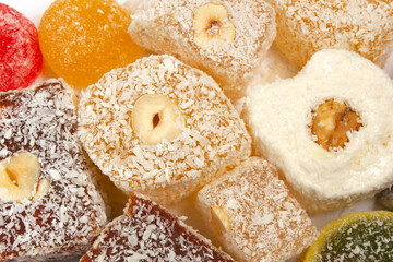 The traditional Turkish dessert Cezerye with hazelnuts. Lokum, Turkish delight.