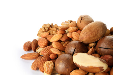 Heap of different tasty nuts isolated on white background