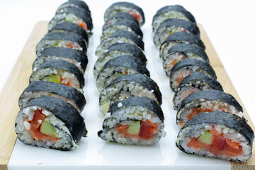 homemade sushi with salmon, cucumber and pepper