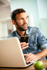 Businessman typing a message. Company manager on his phone sending a message...