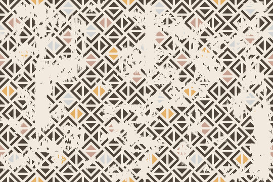 Seamless geometric pattern with an effect of attrition. Abstract retro vector texture. Vintage shabby carpet. Lattice graphic design. Vector tiles pattern in brown and beige.