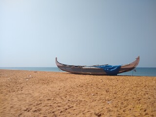 Fototapeta na wymiar Fishing boats on the seashore, seascape view Thiruvananthapuram Kerala