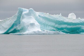 Wide-angle lens shot of a massive iceberg at Disko Bay, Greenland