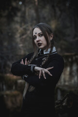 Naklejka premium Witch in the form of a student in the forest