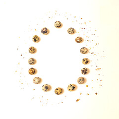 Minimal concept of many different organic natural quail eggs. Flat lay arrangement made with beige background.