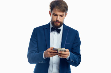 Gentlemen in blue blazer white shirt bow tie wealth model money