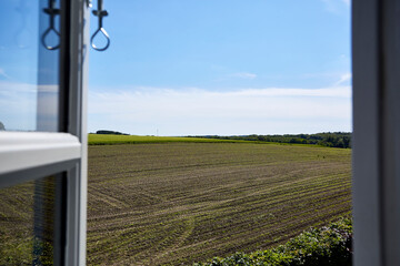 view from window to large empty field