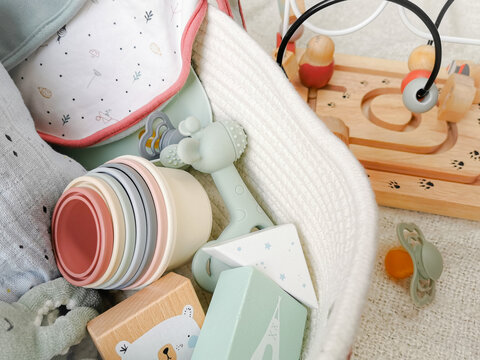 Gender neutral baby shower gift set for a newborn baby in soft colors.