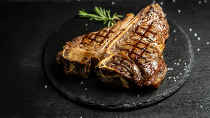 T-bone or aged wagyu porterhouse grilled beef steak with spices and herbs. Gourmet grilled and...