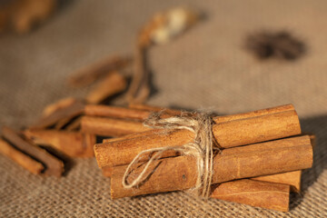 Cinnamon sticks on a wooden background