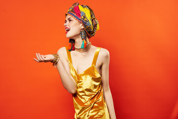 pretty woman decoration multicolored turban luxury red background studio