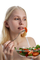 Smiling girl with a salad on a white background