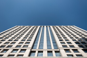 Obraz premium Residential area under blue sky and white clouds