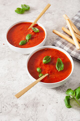 tomato and bell pepper vegetarian soup on green background