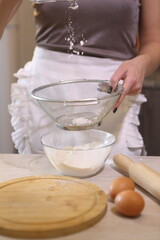 Girl sifting flour