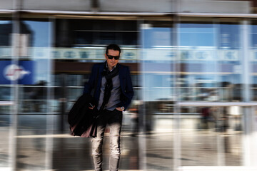 Business in blurred motion at airport gateway.